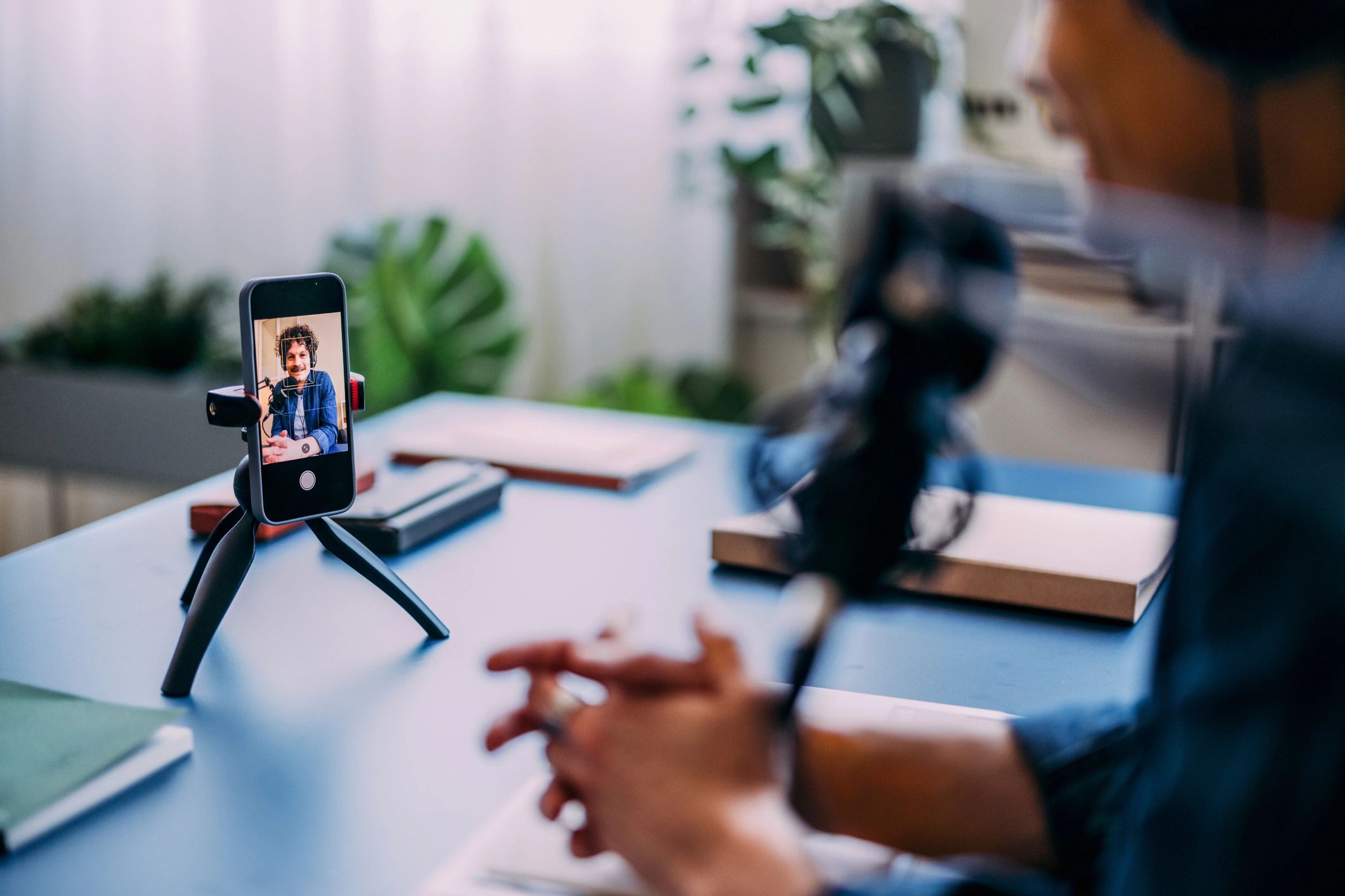 Content creator filming a video tutorial on a smartphone